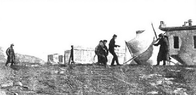 Marconi watching associates raise kite antenna at St. John's, December, 1901